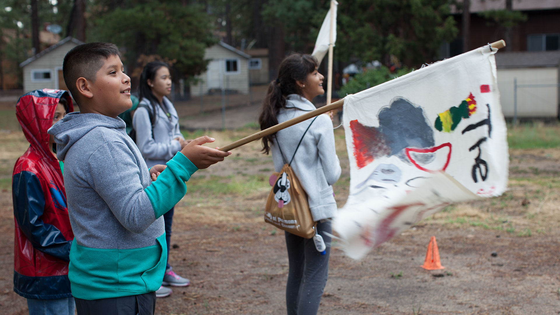 kids holding painted flags