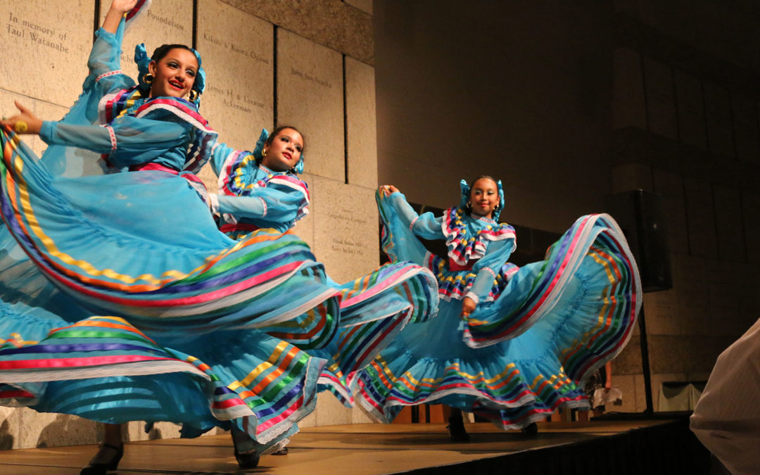 girls performing in cultural dance with beautiful colorful dresses